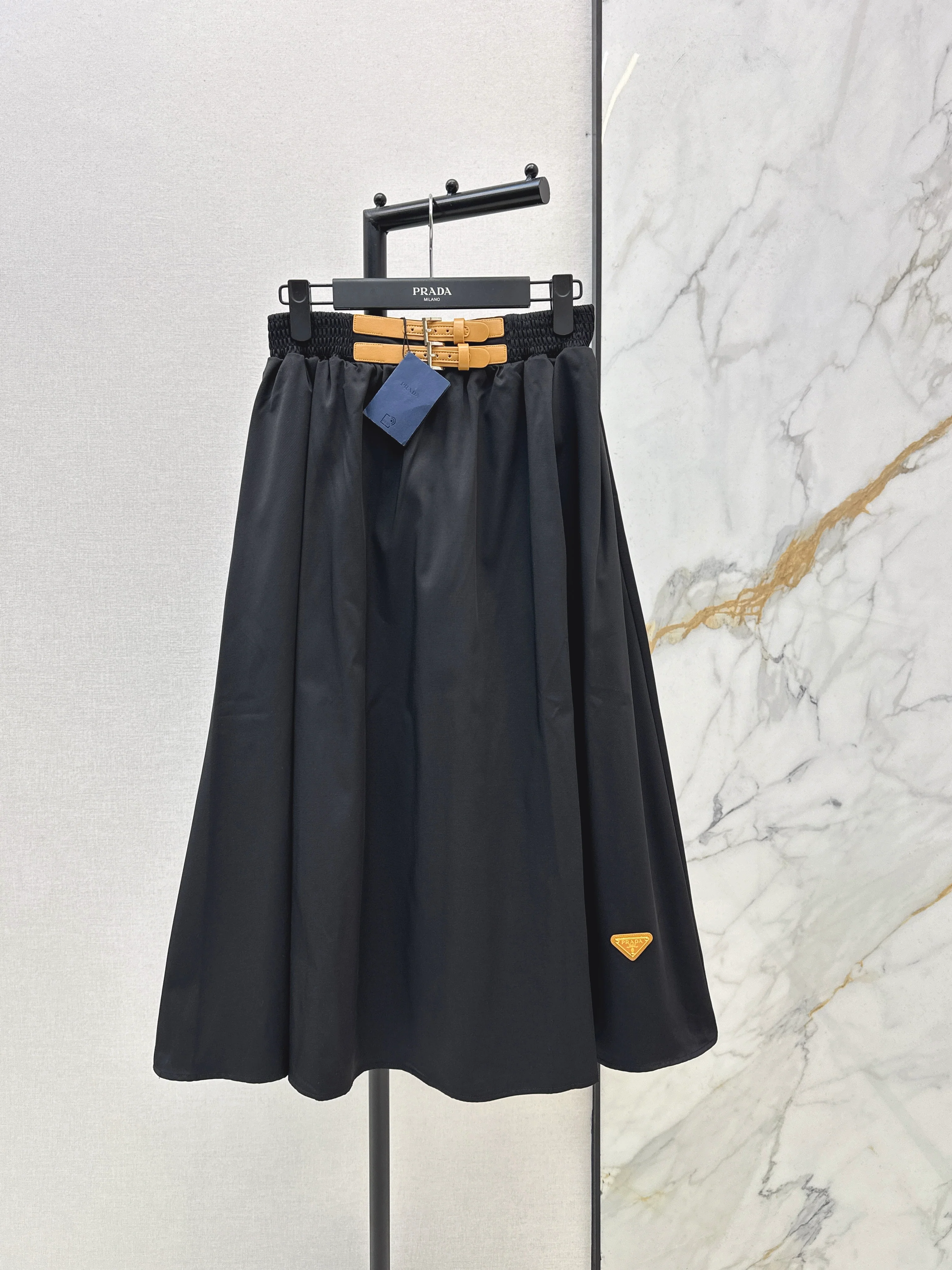 Leather-buckled A-line skirt