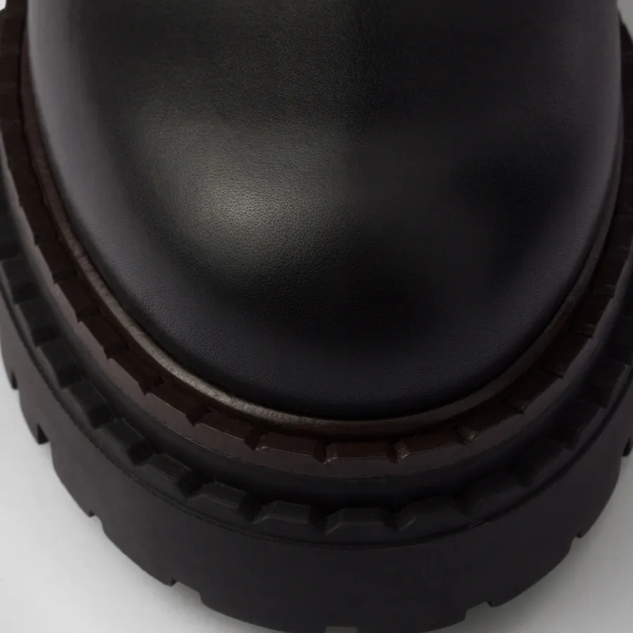 PRADA Black leather and sheepskin boots