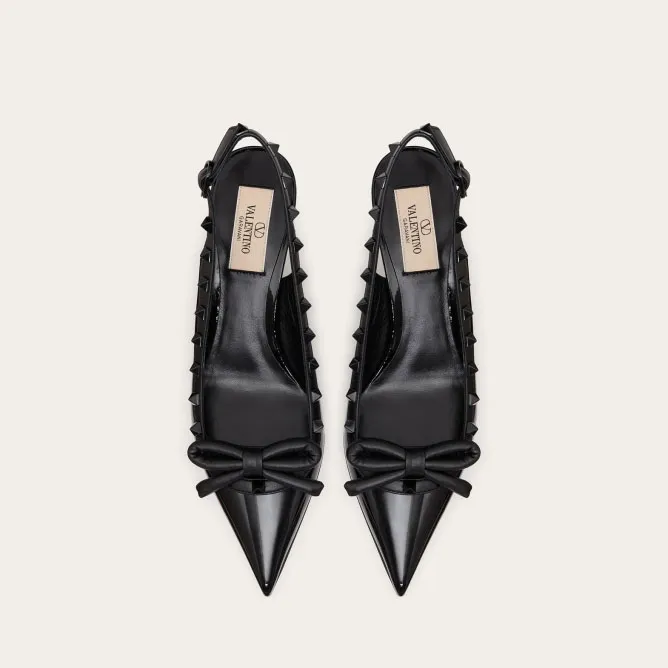 VALENTINO Lace-up heels in patent leather with rivet bow in the same color (heel height: 6cm)