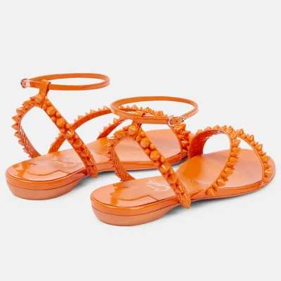 Christian Louboutin Orange flat sandals with diagonal rivets