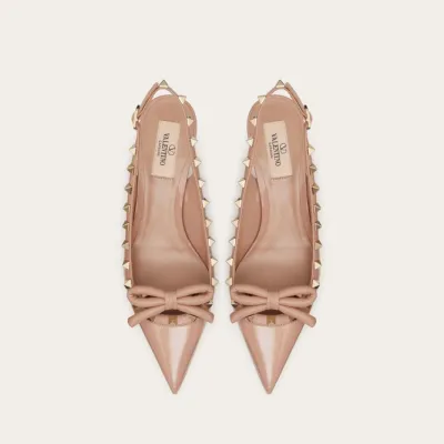 VALENTINO Lace-up heels in patent leather with rivet bow in the same color (heel height: 6cm)