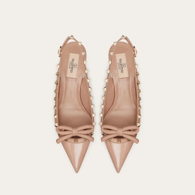 VALENTINO Lace-up heels in patent leather with rivet bow in the same color (heel height: 6cm)