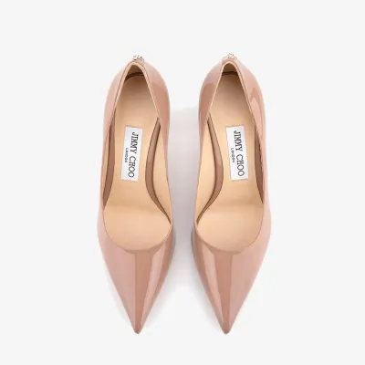 JIMMY CHOO JC badge embellishes pink high heels