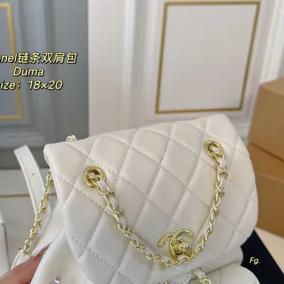 Chanel Pink / Yellow / White / Black Quilted Lambskin Leather Backpacks