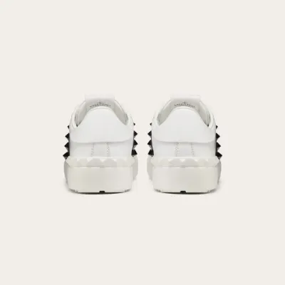 VALENTINO Women's studded calf leather sneakers in the same color