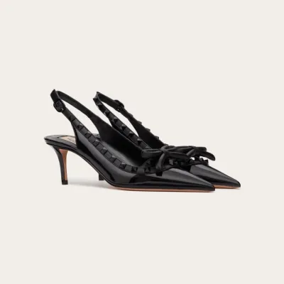 VALENTINO Lace-up heels in patent leather with rivet bow in the same color (heel height: 6cm)