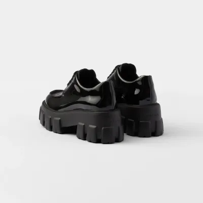 PRADA Black Monolith lacquered leather lace-up shoes