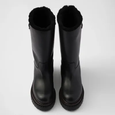 PRADA Black leather and sheepskin boots