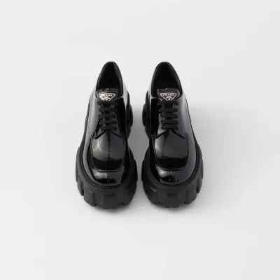 PRADA Black Monolith lacquered leather lace-up shoes