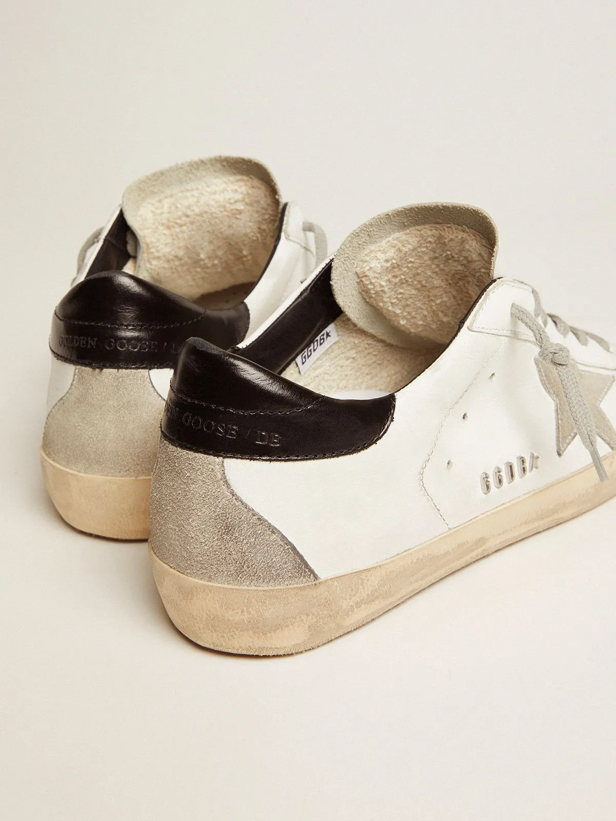 Super-Star sneakers with black heel tab and metal stud lettering