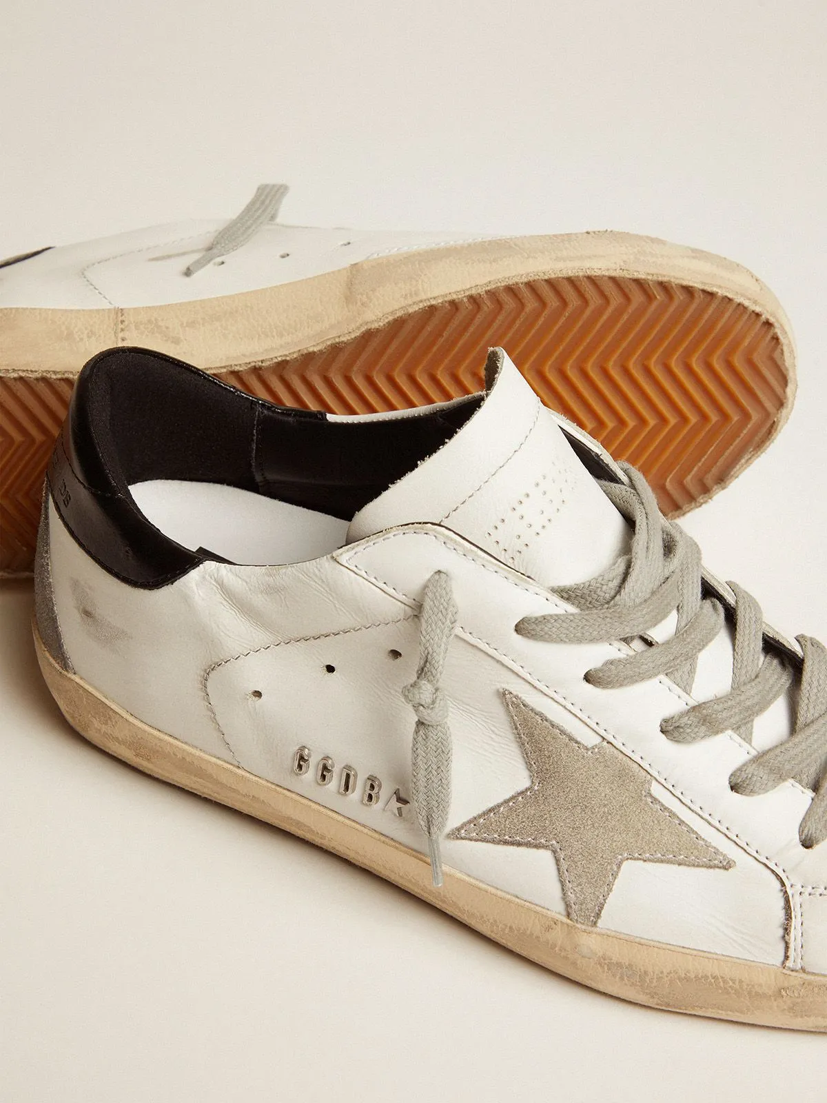Super-Star sneakers with black heel tab and metal stud lettering