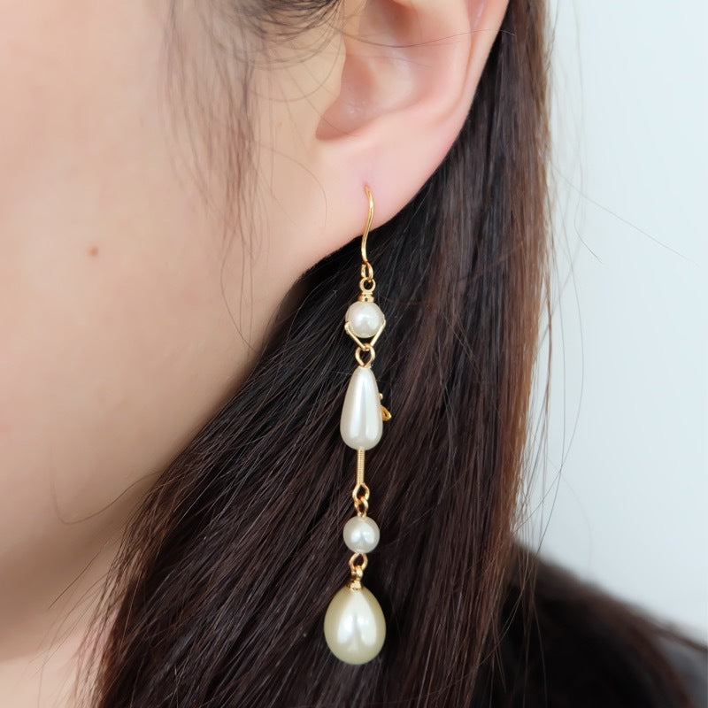 Vivienne Westwood Teardrop Pearl Saturn Earrings - Best Replica Jewelry™