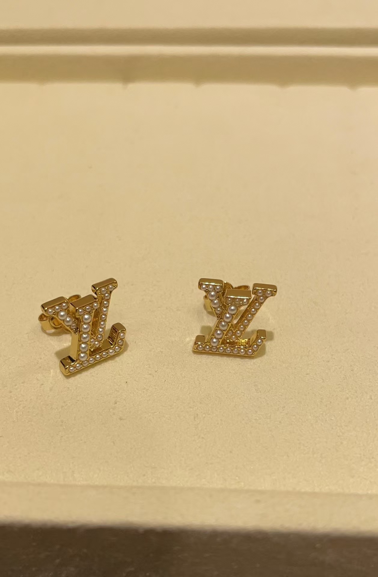 Louis Vuitton Pearl Paved LV Letter Stud Earrings - Best Replica Jewelry™