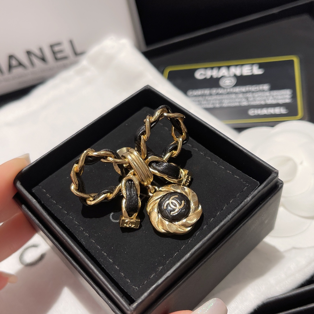 Chanel Black Leather Wrap Gold Bow Brooch - Best Replica Jewelry™