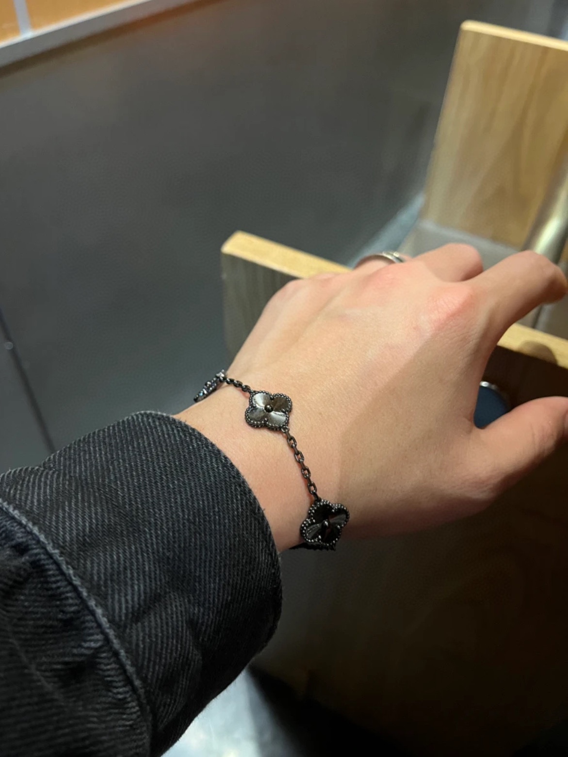 Matte Black Van Cleef Bracelet Worn on Men's Wrist - Vintage Alhambra Design