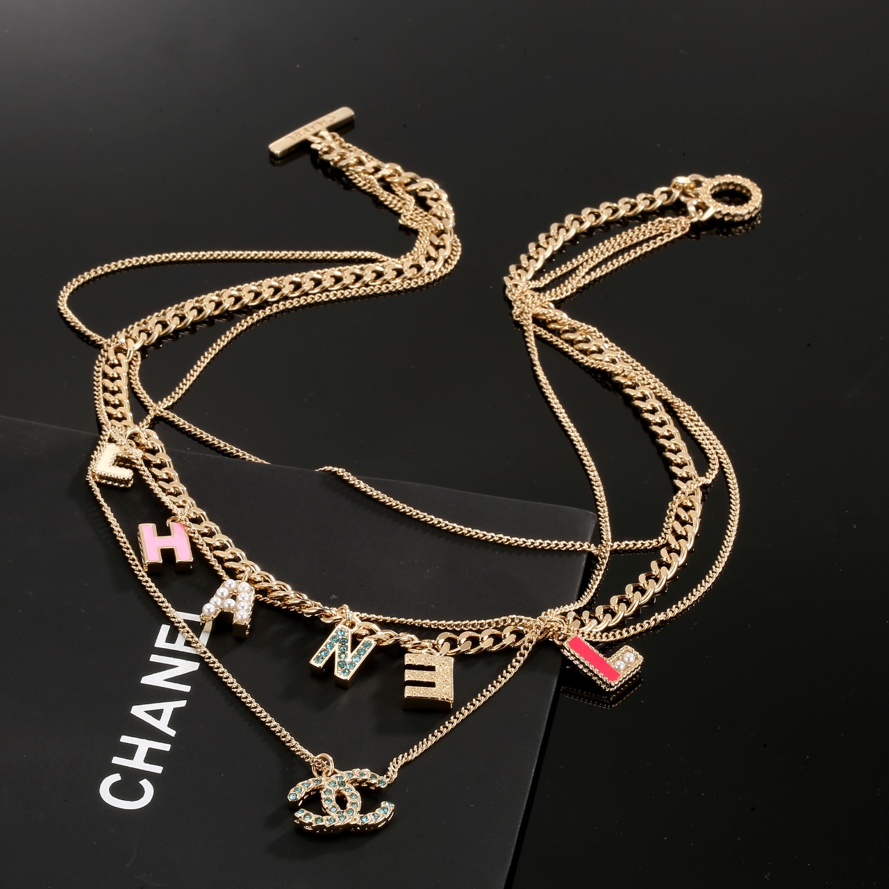 Chanel Multi Layered Light Gold Color Monogram Charms Necklace - Best Replica Jewelry™