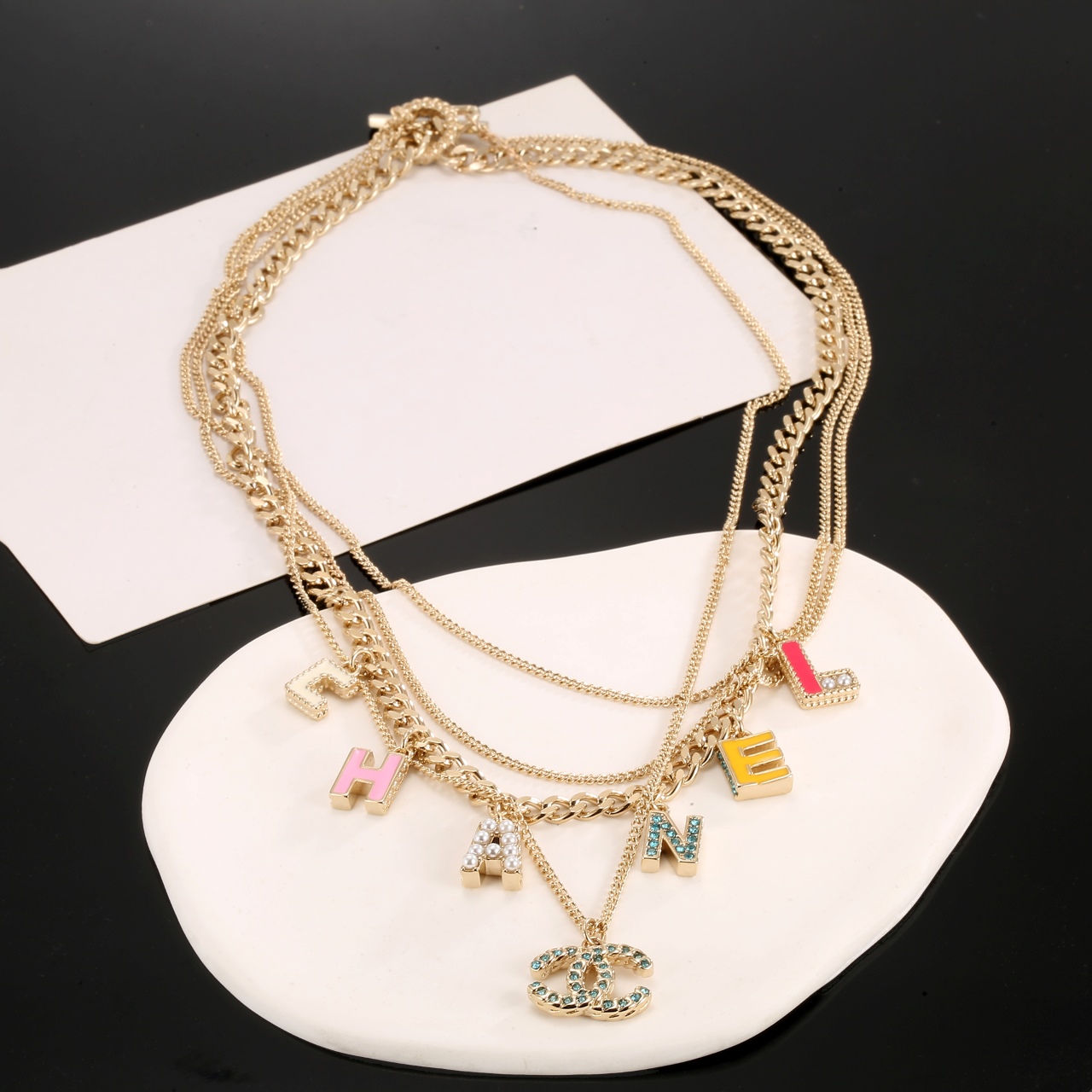 Chanel Multi Layered Light Gold Color Monogram Charms Necklace - Best Replica Jewelry™