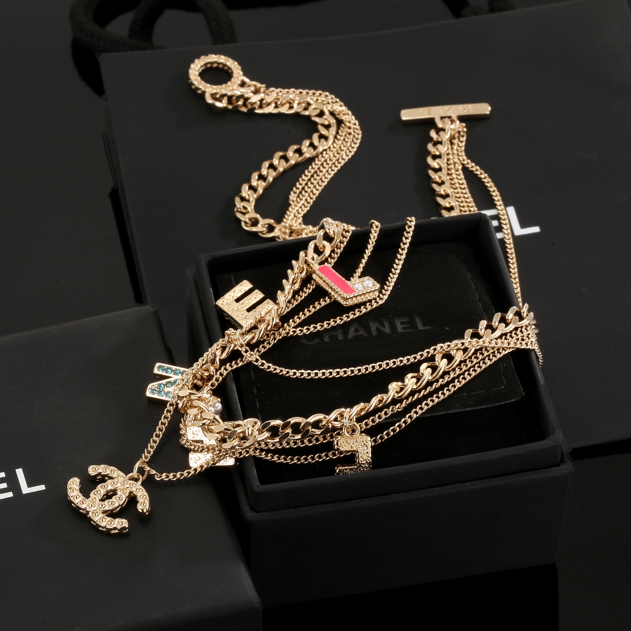 Chanel Multi Layered Light Gold Color Monogram Charms Necklace - Best Replica Jewelry™