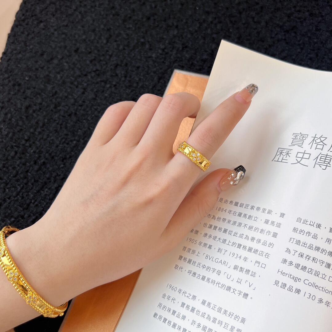 Dupe Van Cleef & Arpels yellow gold Perlee Sweet Clovers Bracelet and ring on hand wrist
