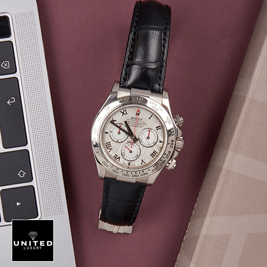 Rolex Daytona 116519 Stainless Steel Case Black Leather Replica on the table