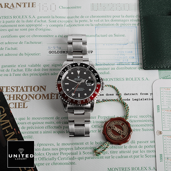 Rolex GMT-Master II Coke 16710 Black & Red Bezel Replica on the warranty certificate