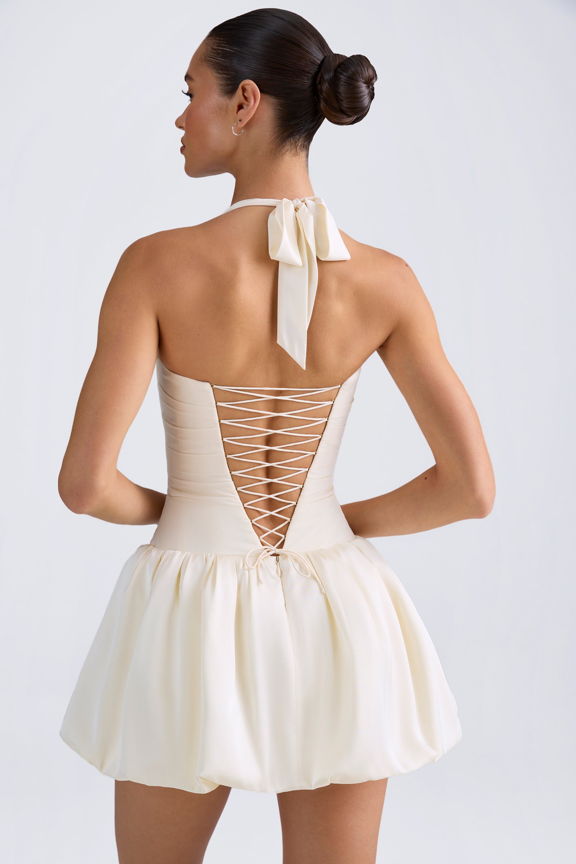 Ludmila-Halterneck Lace-Up Bubble Hem Corset Micro Mini Dress in Ivory