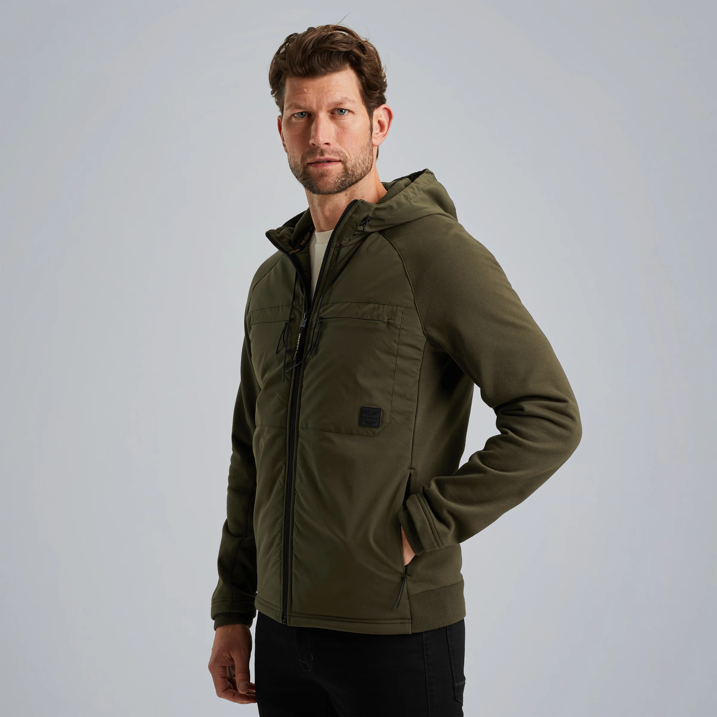 Hybrid jacket in a material mix Green
