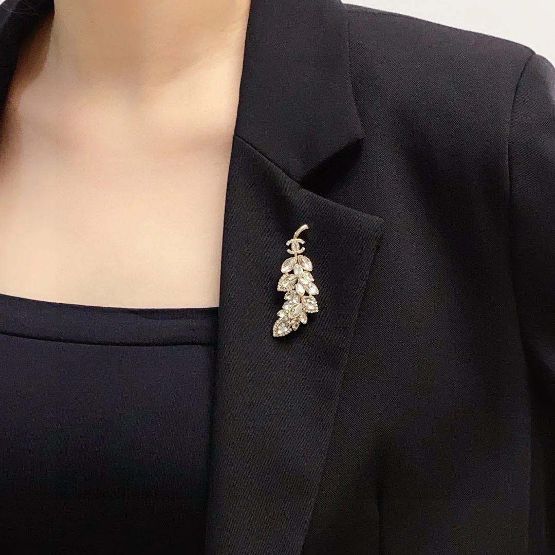 logo brooch