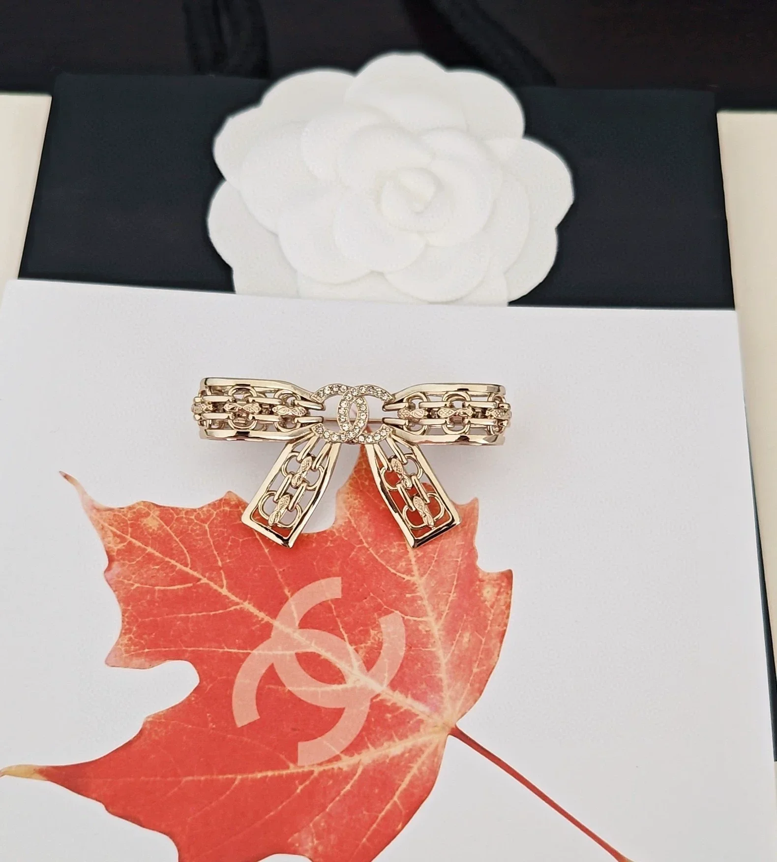 Light gold hollow bow brooch