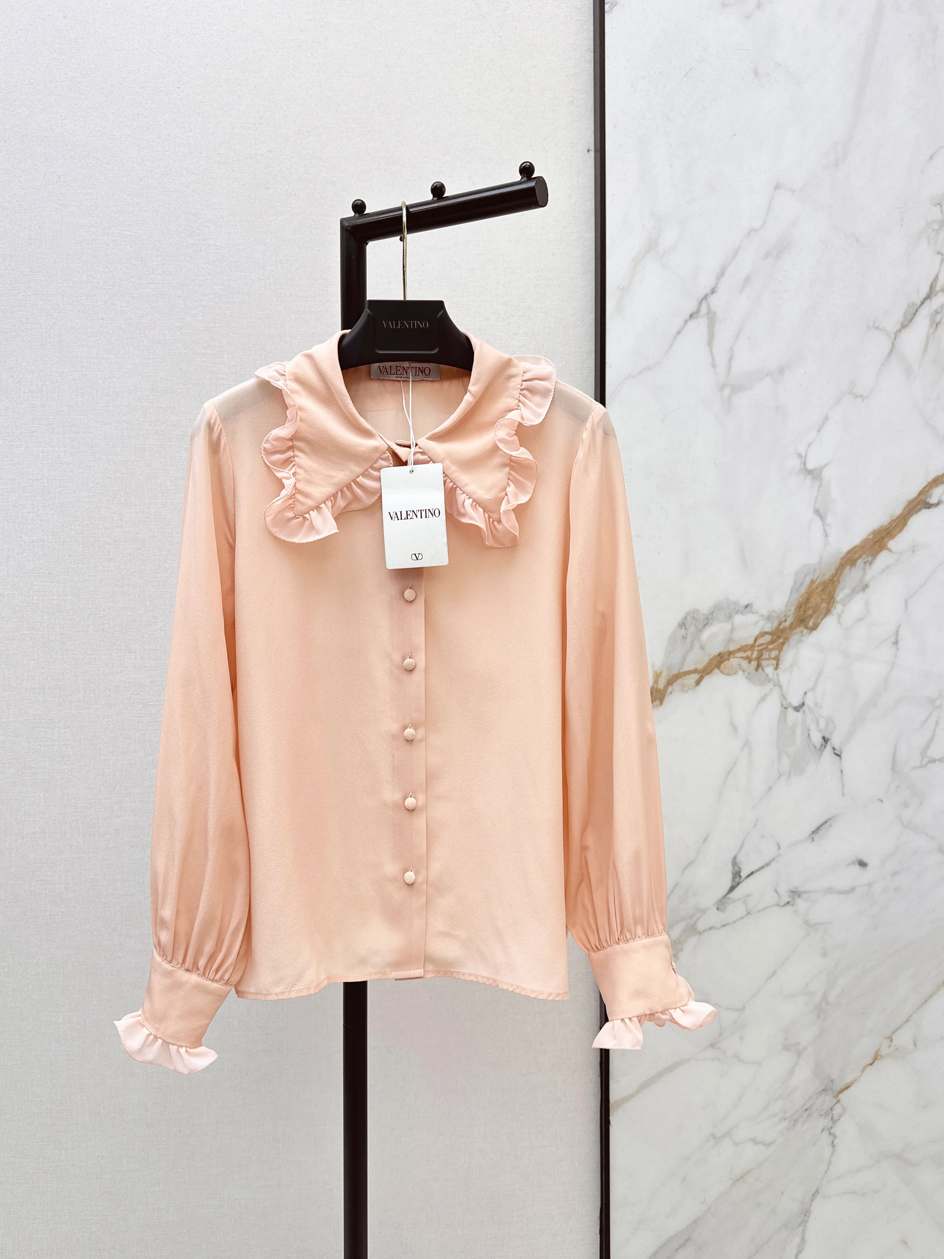 Ruffled trim silk shirt.