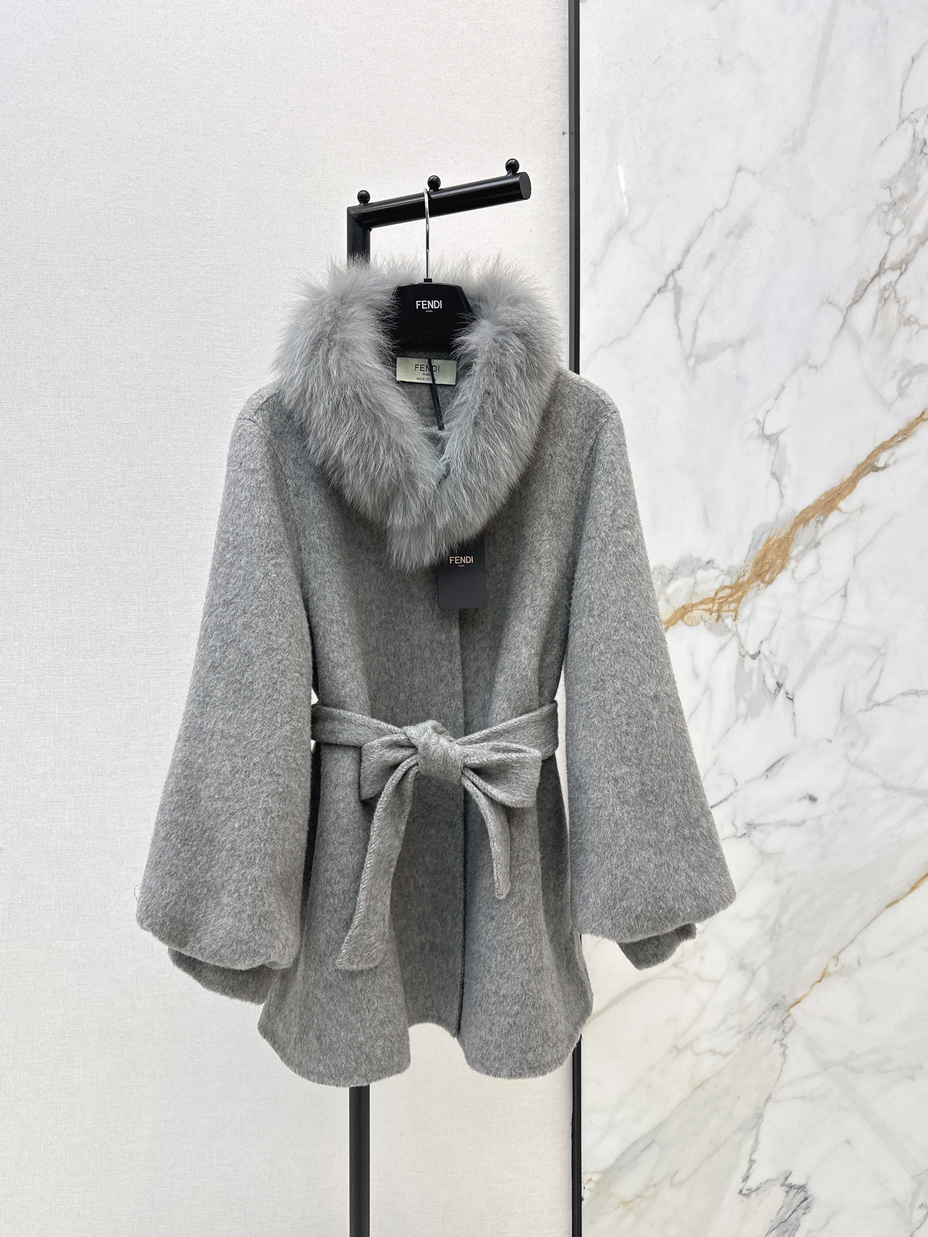 Mid-length coat with fox fur trim