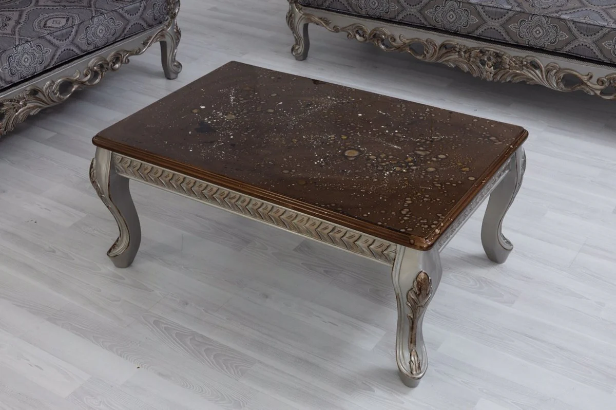 Luxury baroque coffee table brown / silver / bronze 115 x 77 x H. 48 cm - solid wood living room table - living room furniture in the baroque style